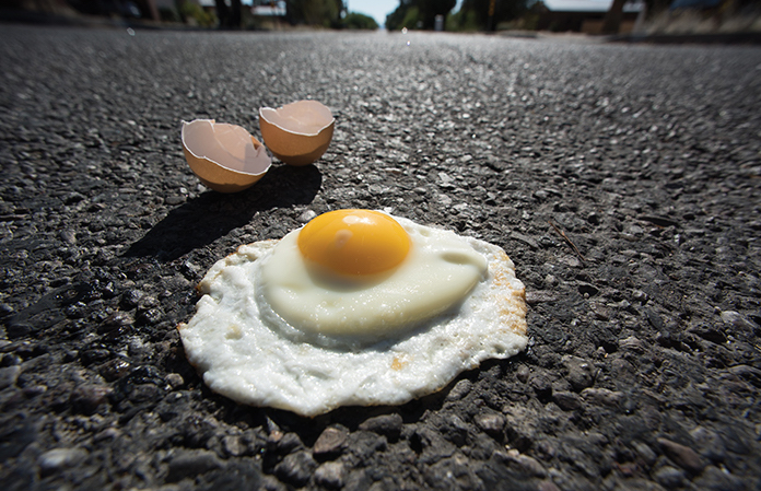 egg frying on ground